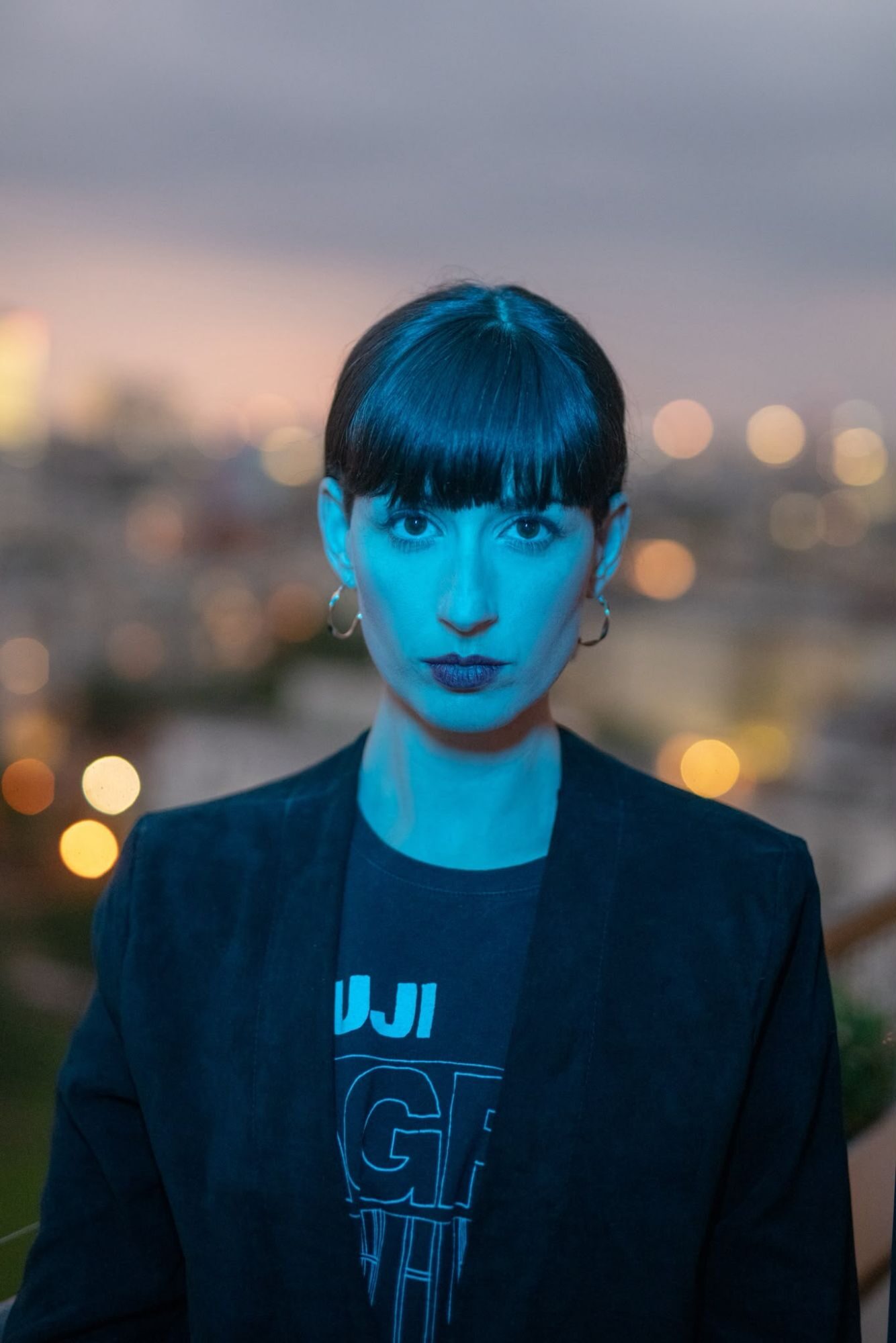 Maya Shenfeld at dusk above the city